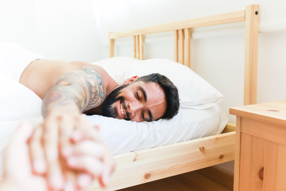 man satisfied in bedroom