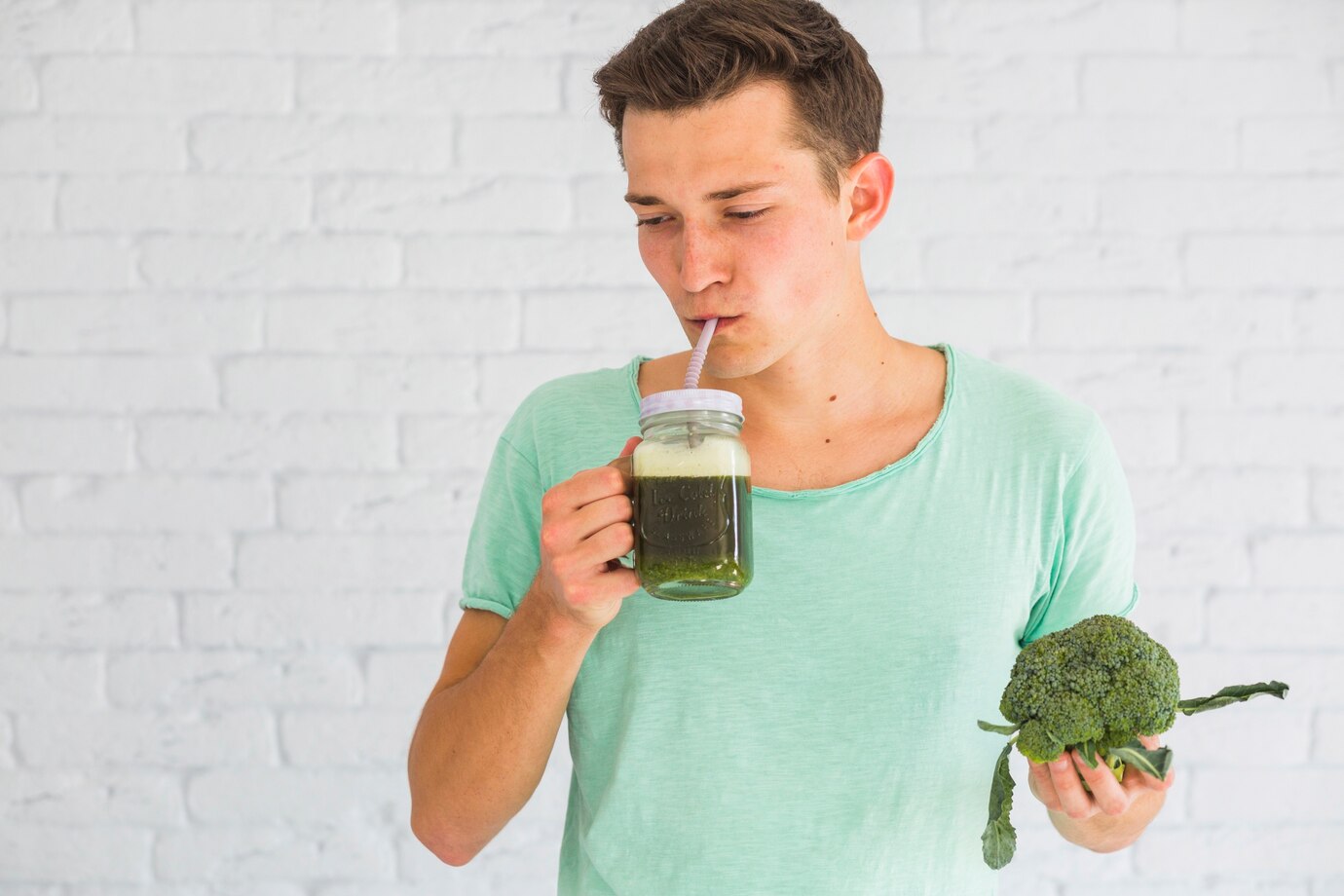 man drinking fresh ayurvedic smoothie